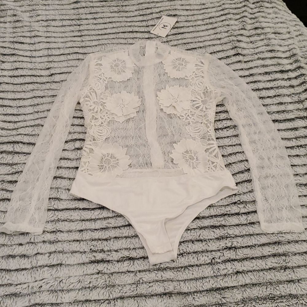 Beautiful white lacy Noir by nature bodysuit